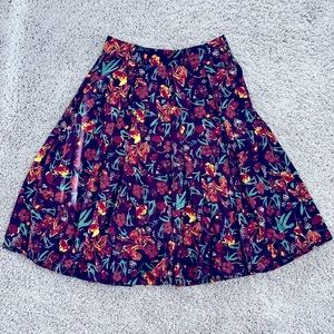 LuLaRoe Madison skirt size xs color purple burgundy teal yellow. HAS POCKETS